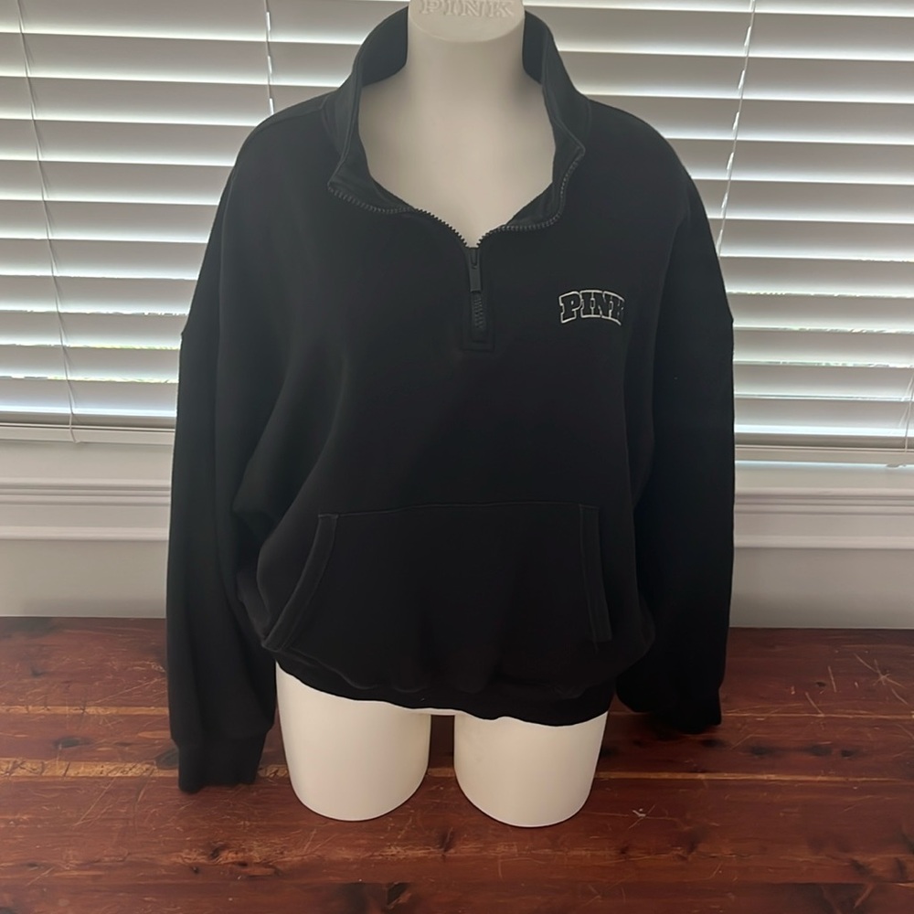Black quarter zip with pockets. Pink brand large.